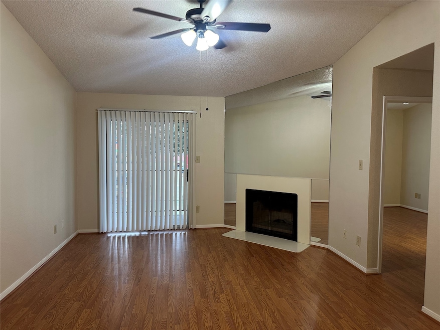 LIVING AREA WITH SLIDING DOOR TO THE BALCONY AND C