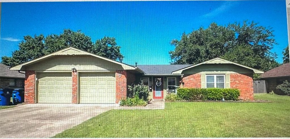 Single story home featuring a garage and a front l
