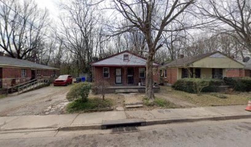 Single story home featuring driveway and covered porch