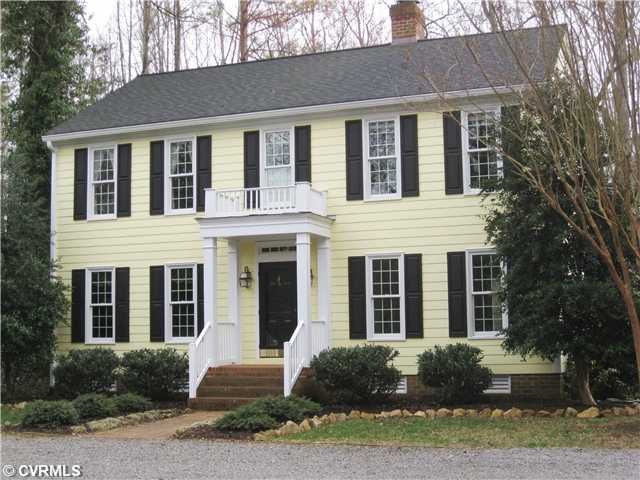 Exterior Front - Front View with Entry Porch and Balcony.