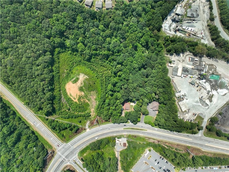 View of property location with a forest