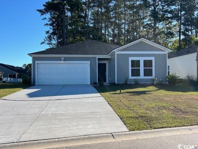 Ranch-style home with a garage and a front lawn