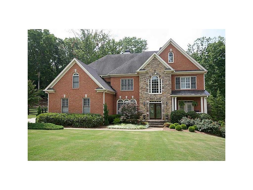 Exterior Front. Custom4 sides brick and stone show