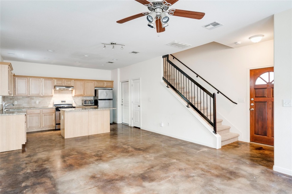 Kitchen featuring appliances with stainless steel