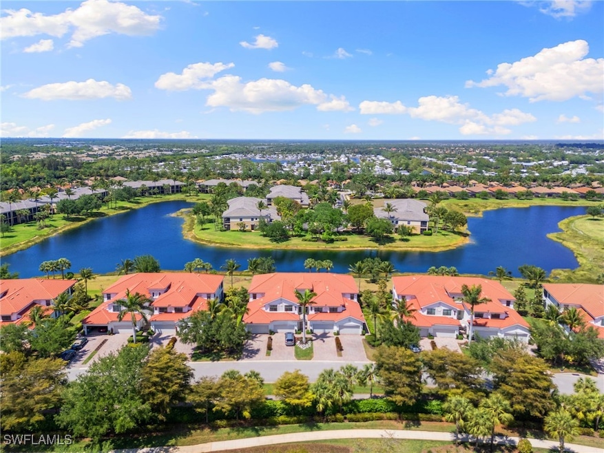 Bird's eye view featuring a water view and a resid