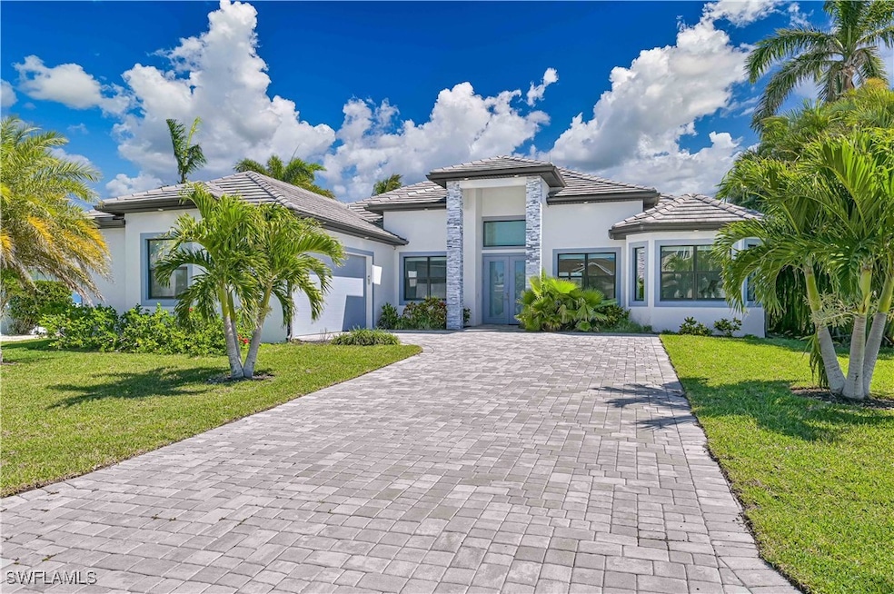 View of front of property with decorative driveway