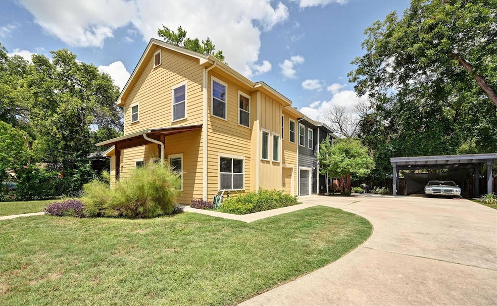 View of front of house with concrete driveway, bo
