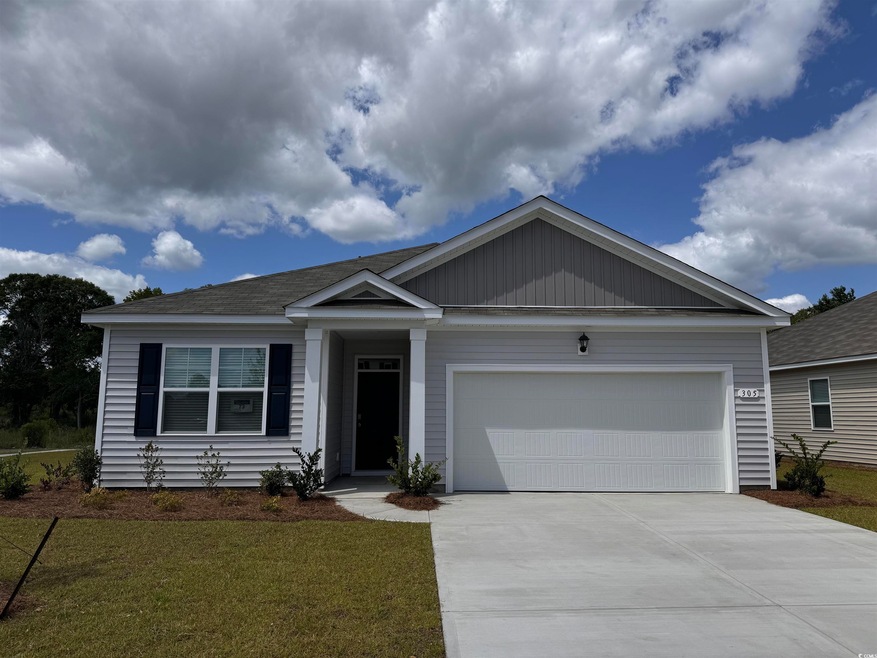View of front of house featuring a garage and a fr