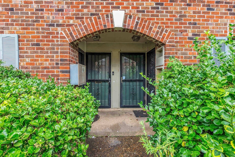 Entrance to property with brick siding