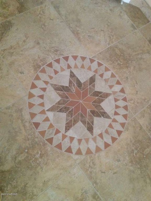 Medallion in tile work at front entry