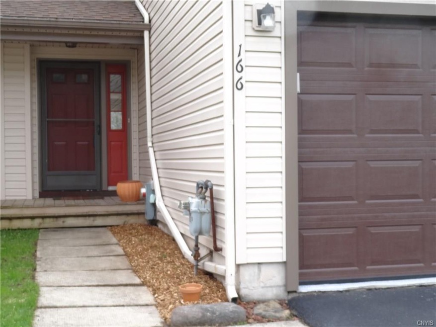 Shot of front walk and garage door/driveway