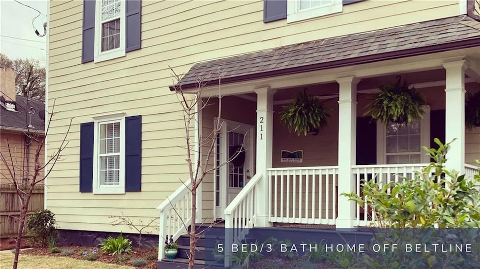 Front porch entry and pretty yard with nice curb a