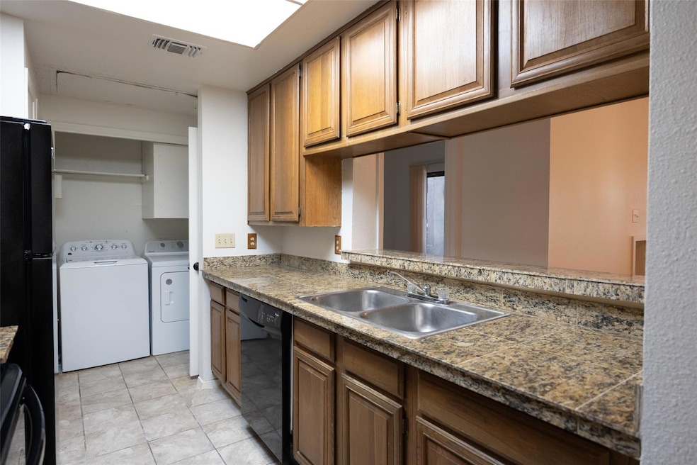 Kitchen featuring light tile patterned floors, vi