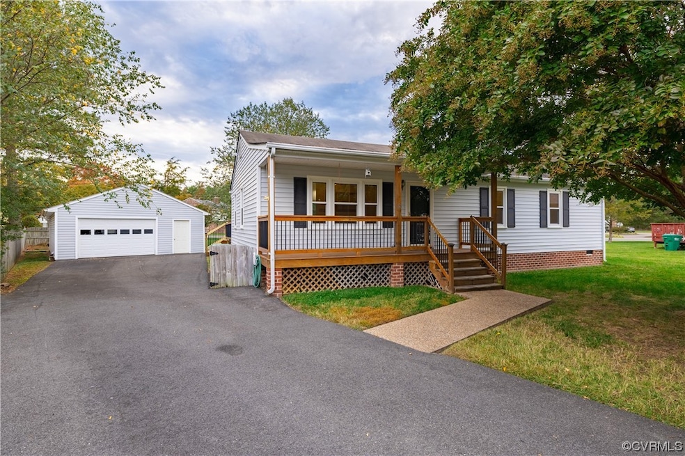 View of front of property with a porch, a garage,