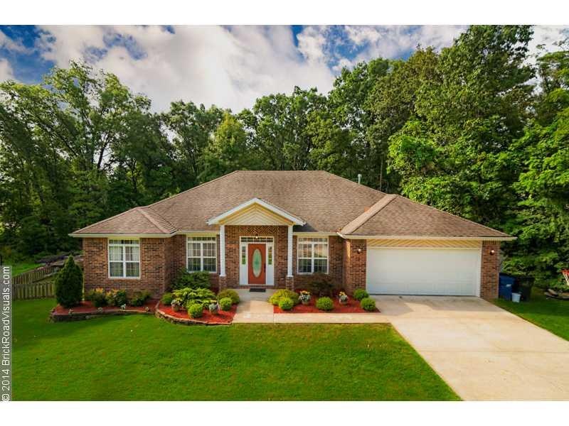 Exterior Front. Gorgeous landscaping and mature trees give this home a real WOW factor!