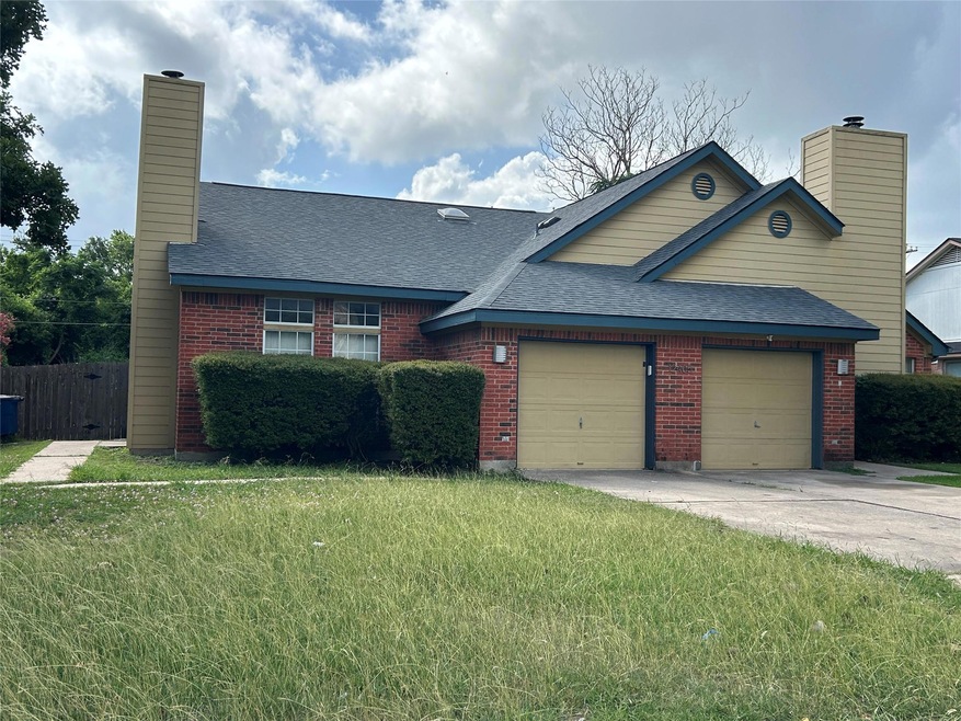 View of front of home with a chimney, an attached