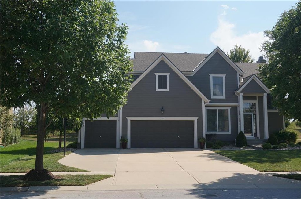 Three car garage with level driveway....