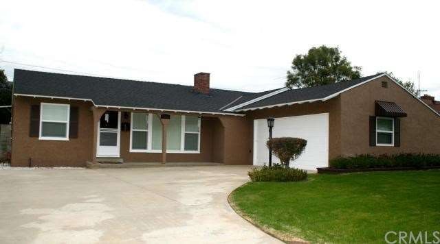 Front of Home with driveway: Newer roof,paint,wind
