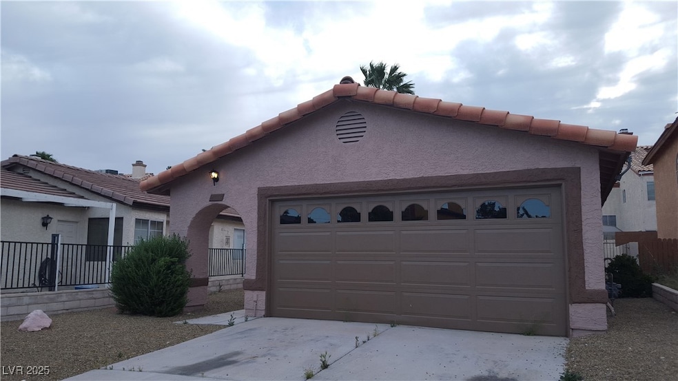 View of front facade featuring stucco siding, an a