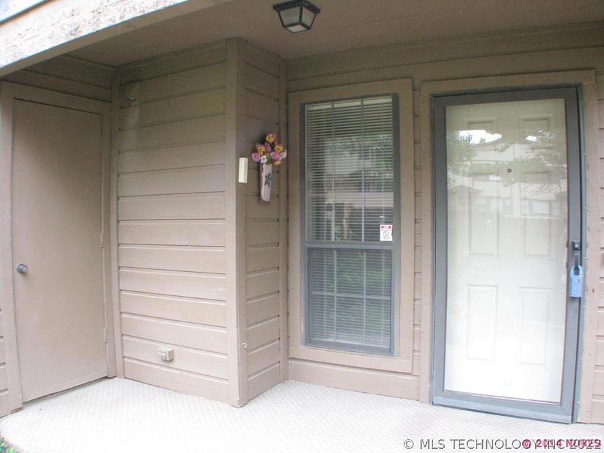 Front courtyard entry with storm door
