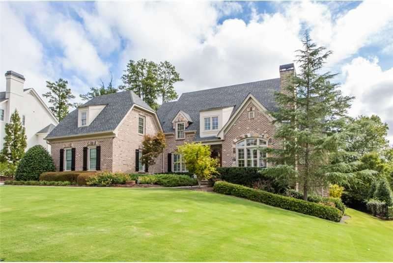 Exterior Front. Beautifully landscaped yard with e