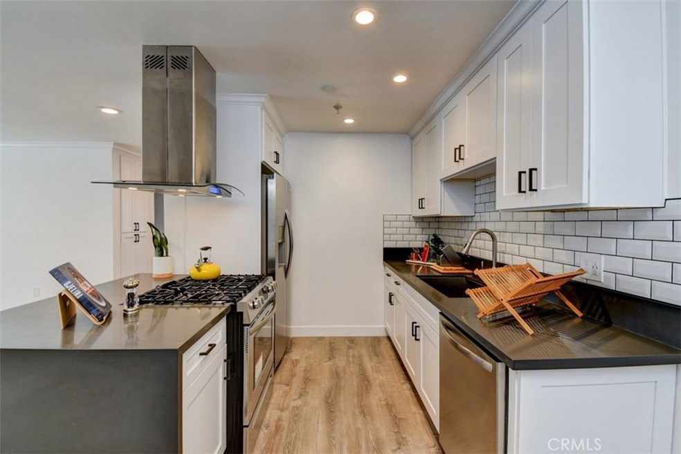 Fully remodeled kitchen with new stainless steel appliances, quartz counters, shaker style cabinets.