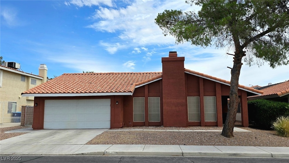 View of front of property featuring a tiled roof,