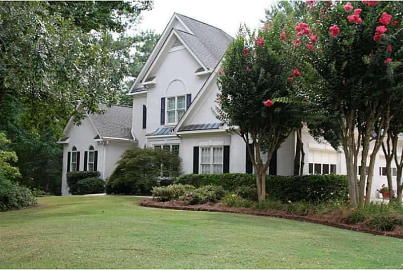 Exterior Front. Traditional Home with 3 Car Garage