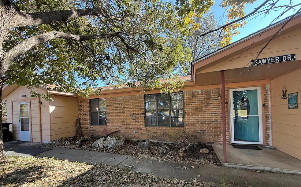 View of front of property with brick siding