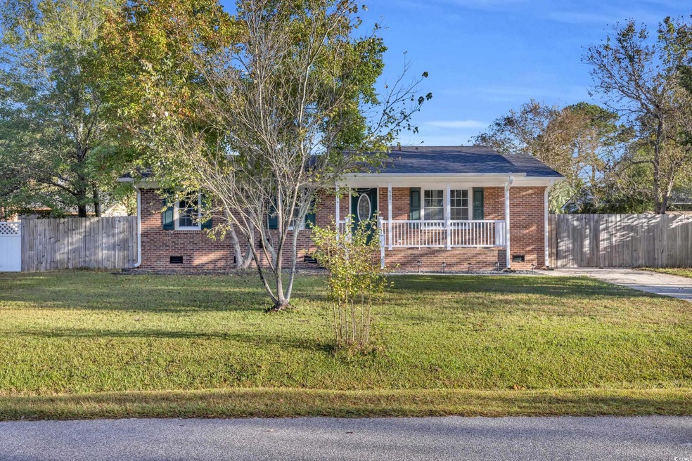 Ranch-style house with a porch and a front lawn