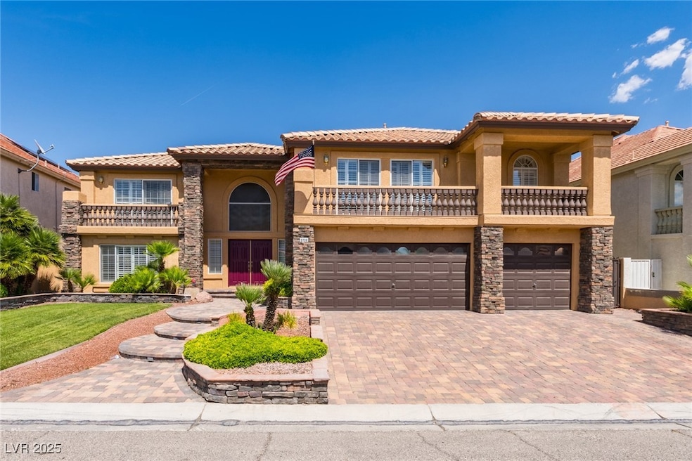 Mediterranean / spanish home featuring a tile roof
