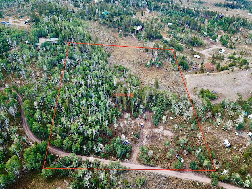 Aerial view of sparsely populated area featuring property parcel outlined