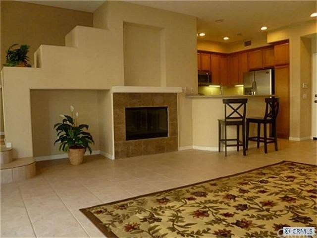 Great room featuring a fireplace, entertainment ni