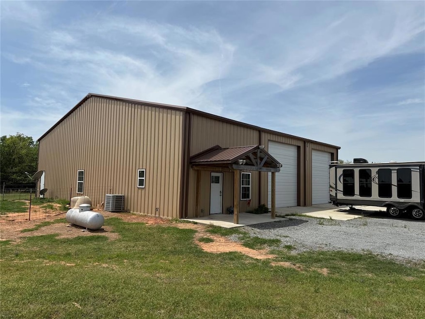 View of outbuilding with central air condition uni