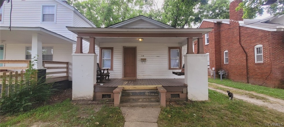 Property entrance with covered porch