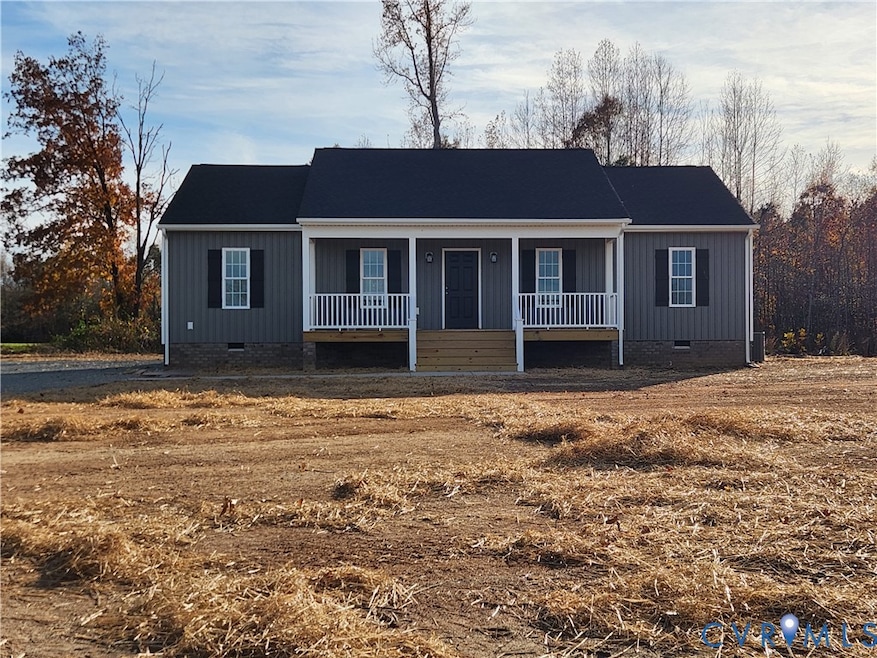 View of front of property featuring crawl space and covered porch