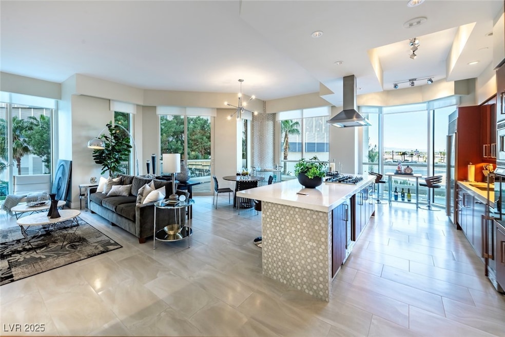 Kitchen featuring island exhaust hood, light count