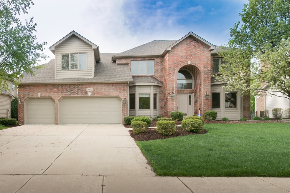 BRICK FRONT 3 CAR GARAGE CEMENT DRIVEWAY