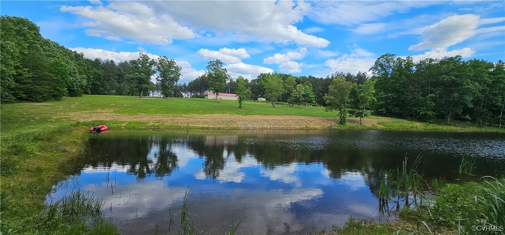 Water view featuring a forest