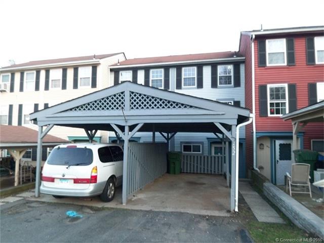 Front of condo and carport