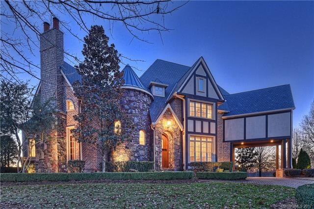 Great curb appeal w/stone tower and porte-cochere.