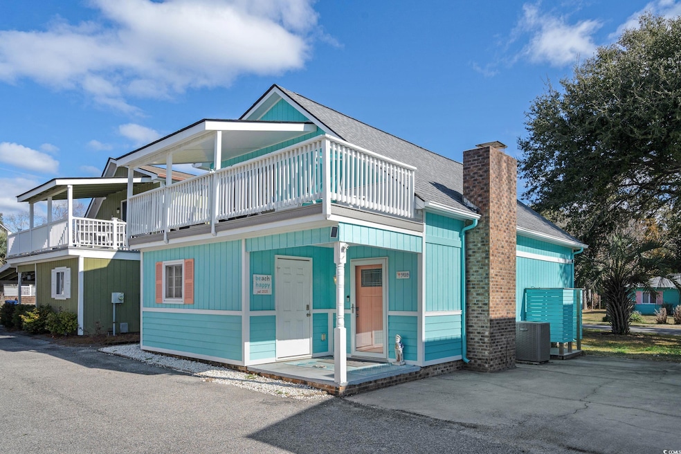 View of front of house with a balcony, a shingled 