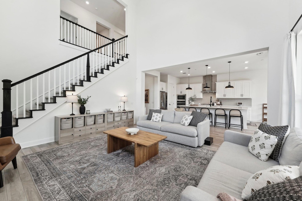 Living area featuring recessed lighting, stairs, 