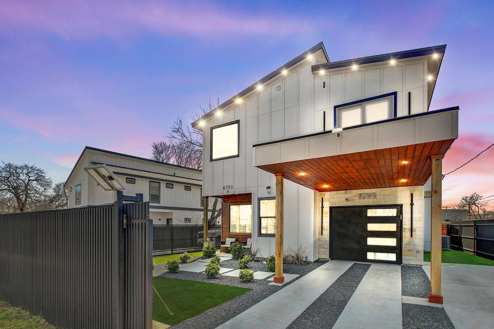 Modern home with board and batten siding and driv