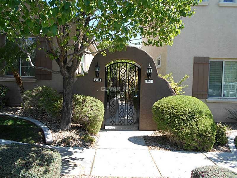 Facade/Exterior Front. Entrance to Courtyard