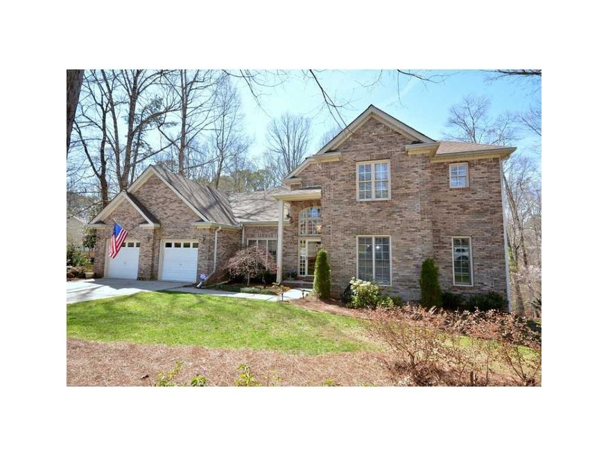 Exterior Front. Stunning brick, custom home in Lak