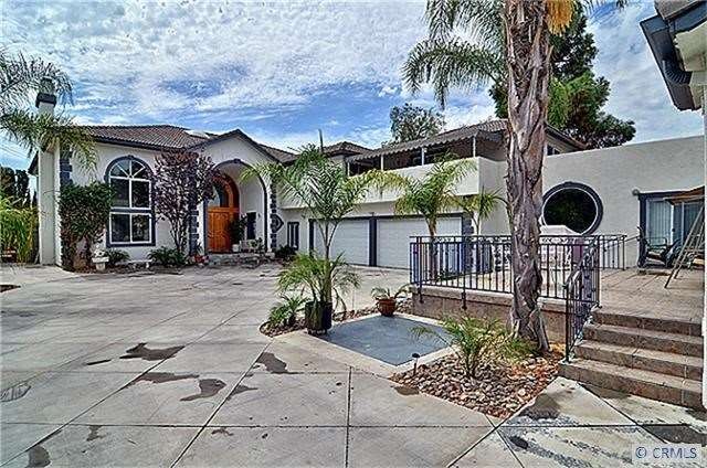 View of motor court, 4 car garage and Main Home en