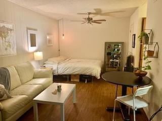 Bedroom with a textured ceiling and wood finished