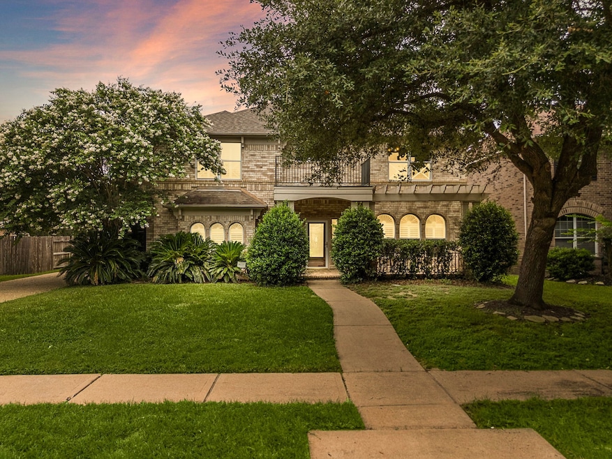 This charming two-story home features a brick exte