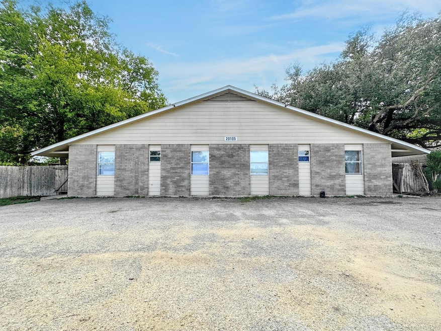 Garage featuring fence